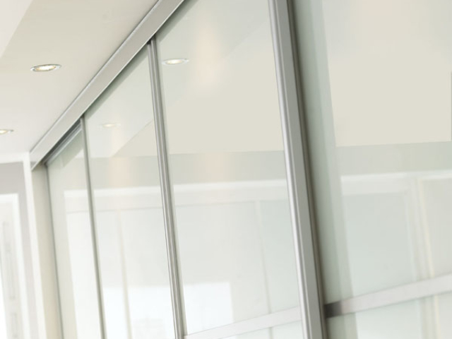 Sliding Wardrobe Silver Frame and White Glass Detail Sliding Wardrobe Silver Frame and White Glass Detail